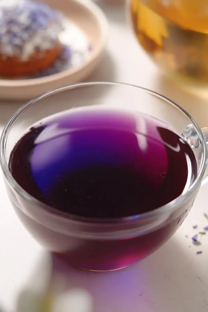 vibrant purple brazilian mounjaro drink in glass cup