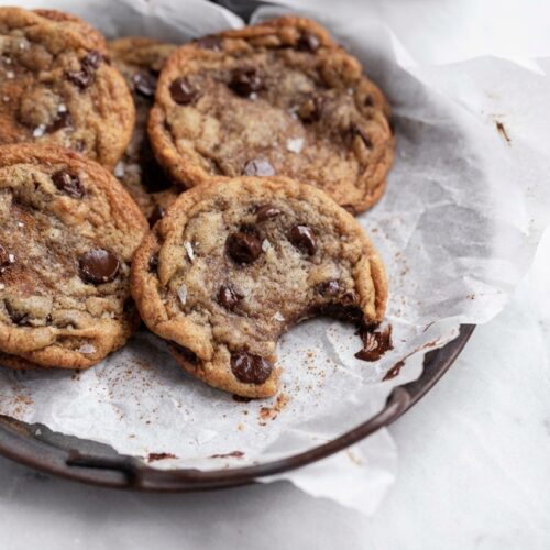Finished banana chocolate chip cookies with a golden-brown exterior and a hint of the unique brown butter and toasted cinnamon infusion.