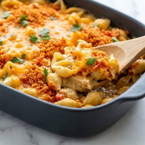 Cheesy chicken casserole topped with golden smoked paprika Ritz cracker crumbles and bubbly sharp cheddar.