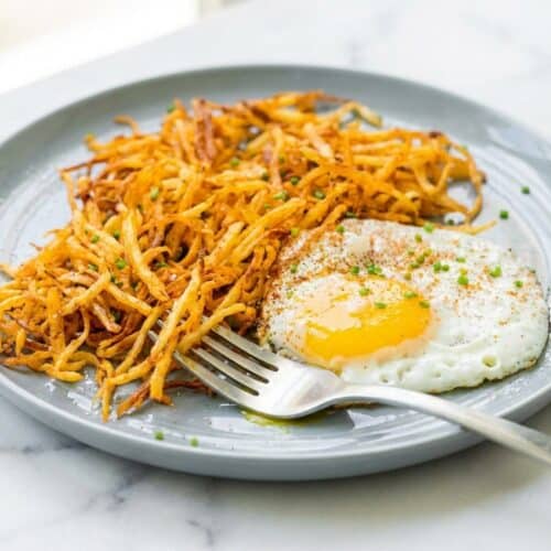 Crispy air fryer hash browns with a cornstarch dusting for extra crunch.