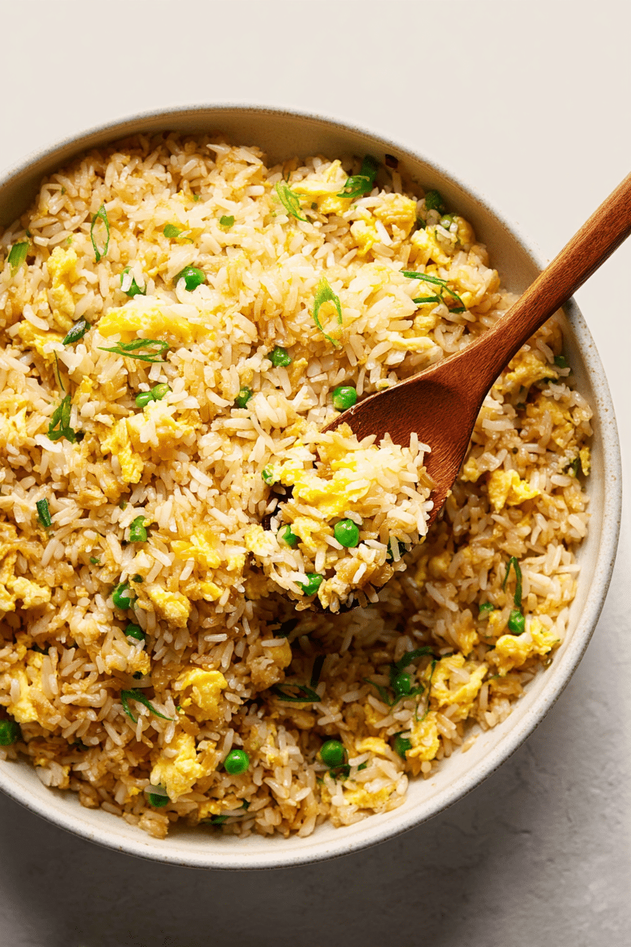 Close-up of golden Fried Rice grains, showing the rich color and firm texture from the Maillard reaction.