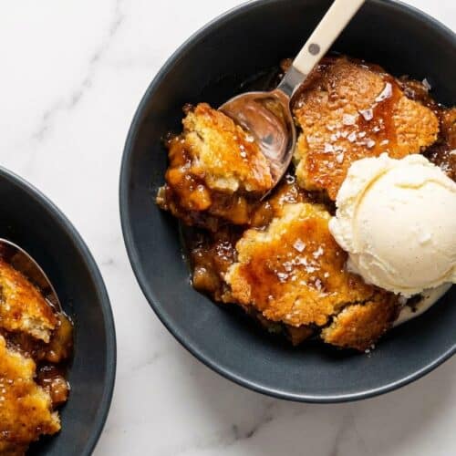 A warm southern chocolate cobbler, its rich, dark surface dappled with flaky sea salt and browned butter aroma.