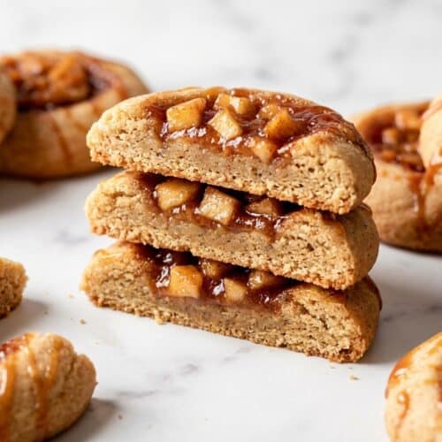 Golden apple pie cookies with a nutty brown butter and cardamom spiced thumbprint base.