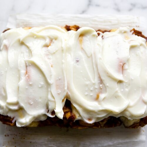 Silky cream cheese glaze with brown butter notes and sea salt drizzled over a fresh bundt cake.