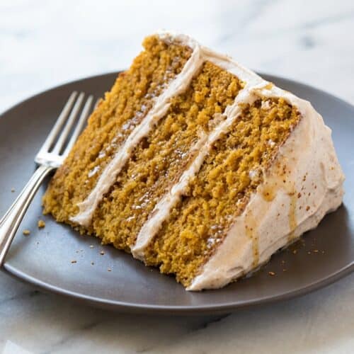 Layered pumpkin cake with cinnamon cream cheese frosting featuring a rich brown butter infusion.