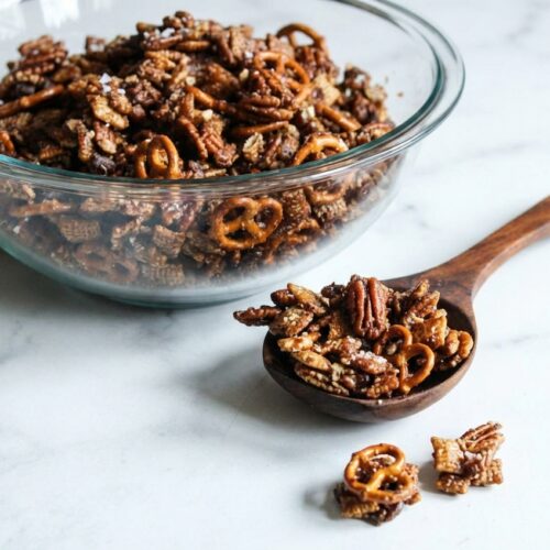 Turtle chex mix with browned butter caramel, toasted pecan halves, and a sprinkle of Maldon sea salt flakes.