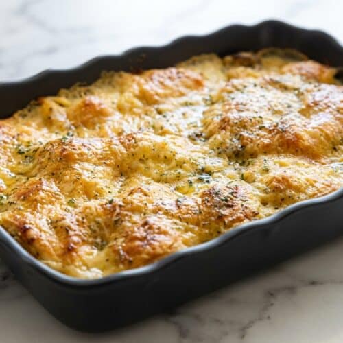 Golden chicken bubble biscuit bake casserole topped with a savory garlic-parmesan herb brush finish.