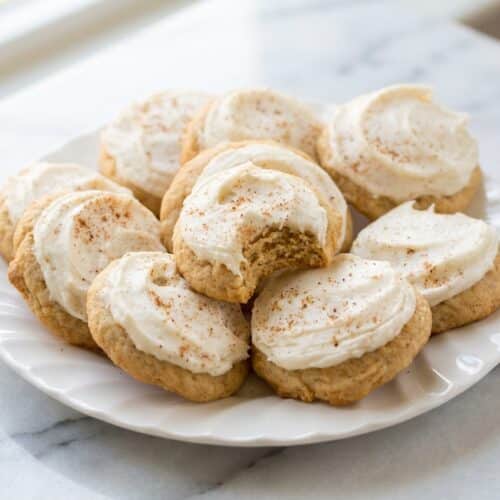 Soft eggnog cookies with brown butter and creamy frosting sprinkled with aromatic ground nutmeg.