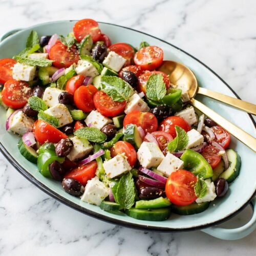 Classic greek salad featuring chunky vegetables and double-oregano marinated feta cubes.