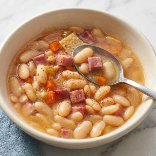 Hearty ham and bean soup with tender Great Northern beans, infused with umami parmesan rind and smoky paprika.