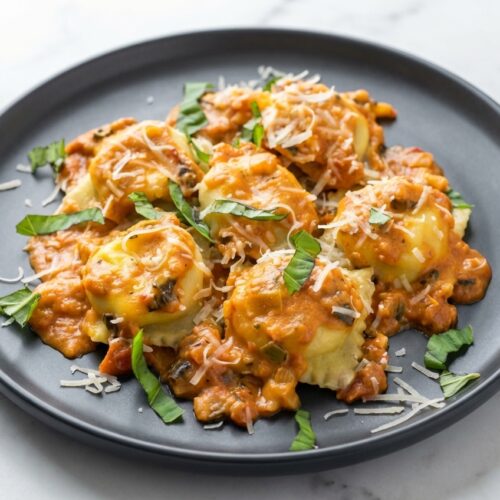 Lobster ravioli recipe featuring saffron-infused golden pasta dough and a rich brown butter sauce.