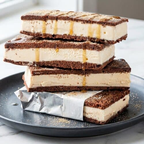 Stacked ice cream sandwiches featuring a malted milk infusion and dark chocolate wafers.