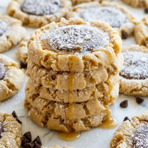 Thick muddy buddy cookies dusted with powdered sugar and finished with a pinch of flakey sea salt.