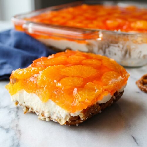 Creamy orange pretzel parfait with a salted brown butter crust and vibrant mandarin orange gelatin layers.