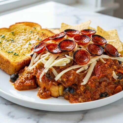 Pepperoni pizza sloppy joes on garlic-butter brioche topped with a crispy pepperoni crown and melted mozzarella.