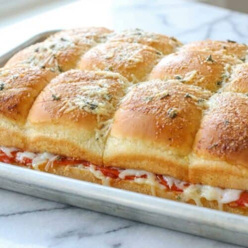 Cheesy pizza sliders hawaiian rolls featuring a moisture barrier for a perfectly crisp, non-soggy crust.