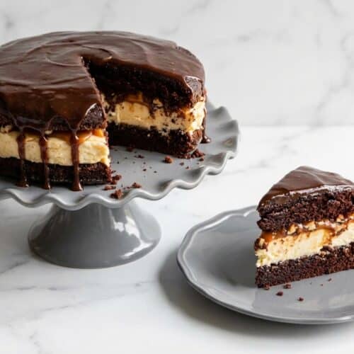 Salted caramel chocolate cheesecake cake with a double-dark brown butter infusion and glossy ganache topping.