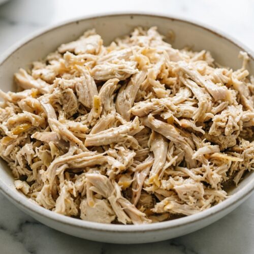 Juicy shredded chicken tossed in a savory herb and garlic reduction sauce.