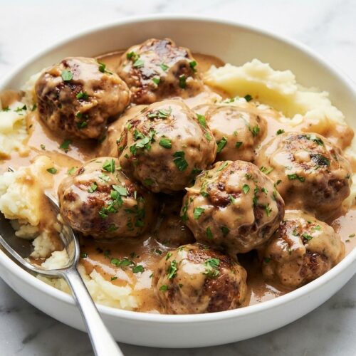 Tender swedish meatballs smothered in a rich, velvety umami-infused brown butter gravy.