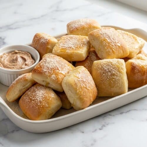 Soft texas roadhouse rolls featuring a malted milk secret for a richer, toasted flavor.