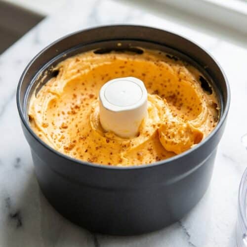 Whipped orange butter recipe featuring toasted browned butter solids and fresh citrus zest in a bowl.