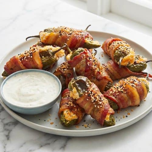Bacon Wrapped Jalapeño Poppers topped with a crispy Everything Bagel panko crunch.
