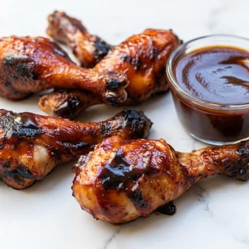 Glazed bbq chicken drumsticks with caramelized skin from an apple cider vinegar spritz and high-heat finish.