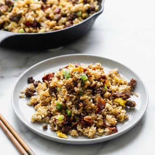 Crispy breakfast fried rice featuring a golden miso-butter finish and savory aromatics.