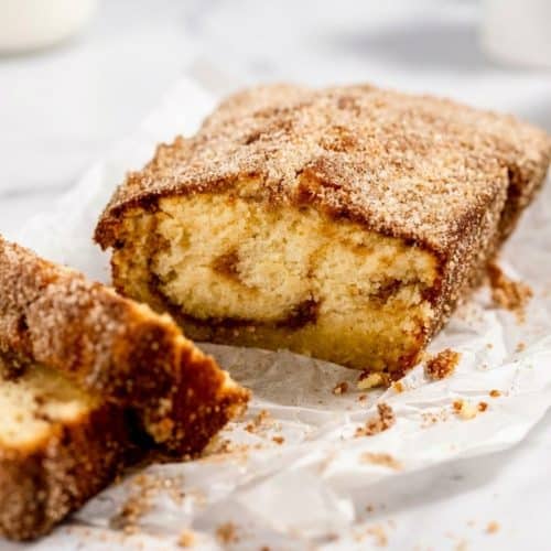 Cinnamon donut bread with a sparkling brown butter cinnamon sugar coating and golden, tender crumb.
