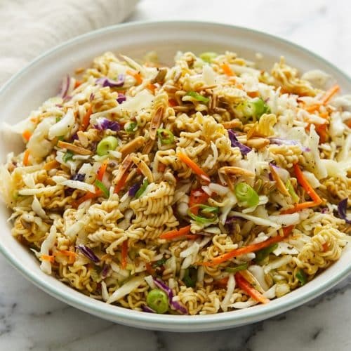 Ramen noodle salad with golden brown butter and miso toasted noodles, edamame, and crisp napa cabbage.