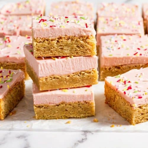 Frosted sugar cookie bars featuring a rich brown butter base and thick Lofthouse style cream cheese frosting.