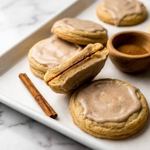 Stack of brown sugar pop tart cookies with browned butter dough and filling, topped with a sweet cinnamon glaze.