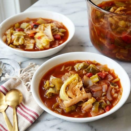 A bowl of this cabbage soup diet recipe featuring oven-roasted aromatics, fire-roasted tomatoes, and tender chopped cabbage.