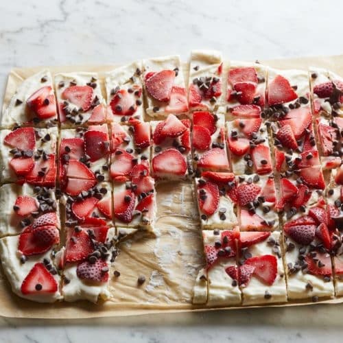 Slabs of Chocolate Yogurt Bark with an almond butter swirl and crackly chocolate magic shell drizzle.