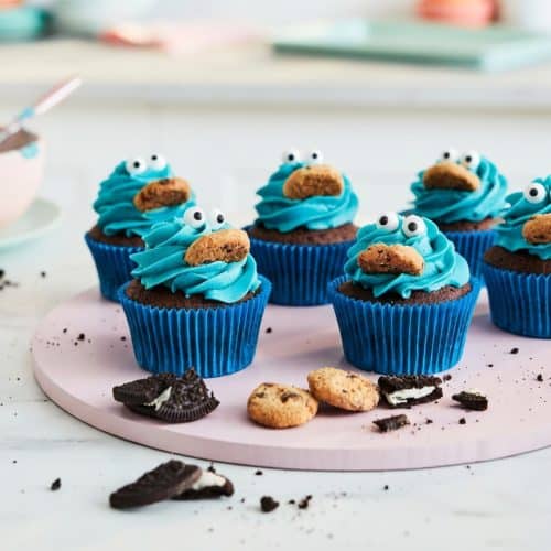 Cookie Monster Cupcakes with shaggy blue frosting and a hidden salted cookie dough core.