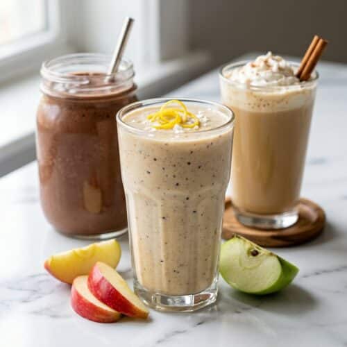 Creamy cottage cheese smoothie topped with bright lemon zest and a pinch of flaky sea salt in a glass.