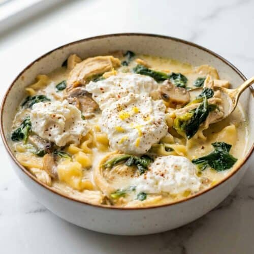 Creamy white lasagna soup topped with a bright lemon and nutmeg infused ricotta garnish.