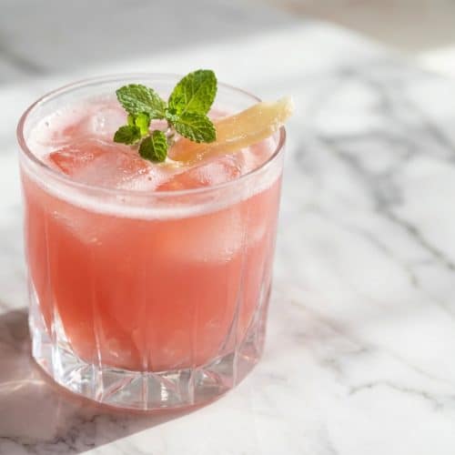 Vibrant cubes of Dr Oz Pink Gelatin Recipe prepared with a refreshing ginger-mint herbal infusion steep.