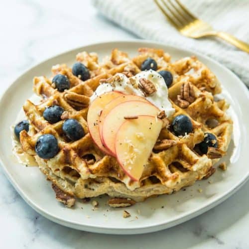 Golden protein waffles recipe featuring a pinch of sea salt and baking powder for a light, airy rise.