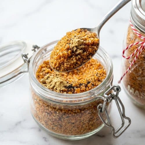 Friendship tea recipe in a glass mug with aromatic ground ginger and flecks of real vanilla bean.