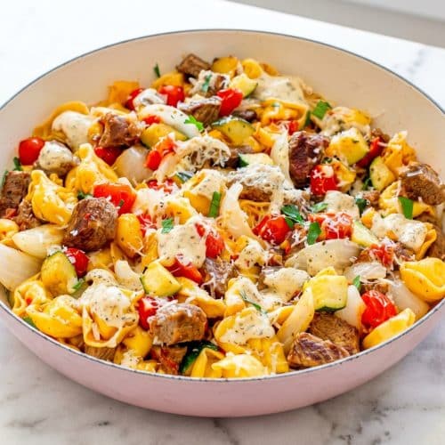 Garlic Parmesan Steak Tortellini with seared sirloin bites in a rich, homemade Parmigiano-Reggiano heavy cream sauce.