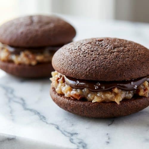 German chocolate whoopie pies filled with coconut pecan custard and a salted espresso ganache layer.