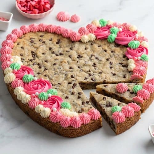 Heart Shaped Cookie Cake decorated with buttercream, featuring a rich brown butter and bourbon vanilla base.