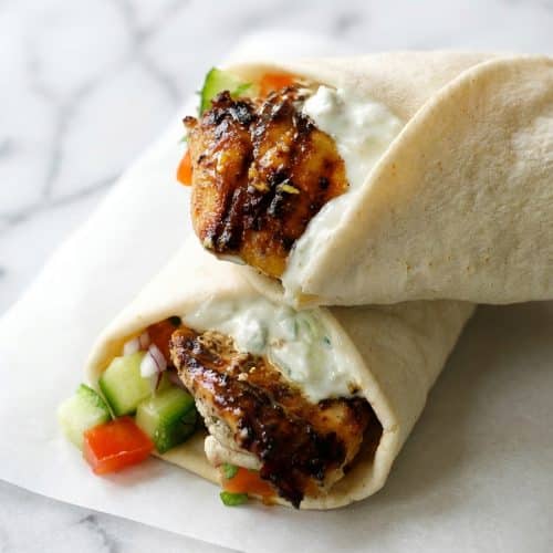 Golden chicken gyros with a sticky honey-lemon flash-sear finish tucked into soft pita bread.