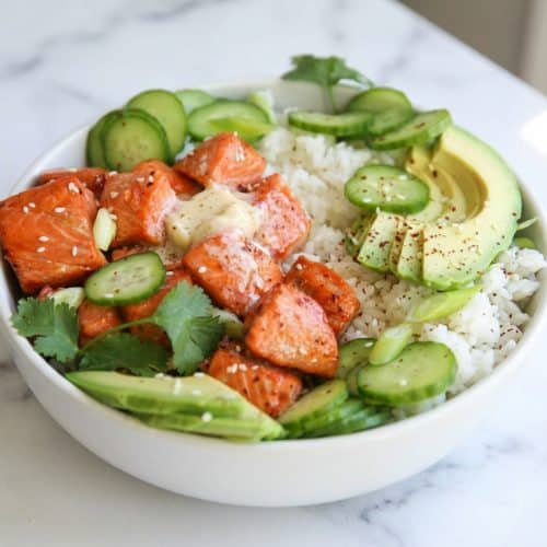 Hot honey salmon bowl topped with a melting cold-infused miso butter finish over fluffy jasmine rice.