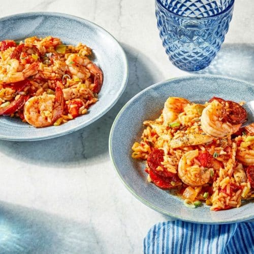 Smoky jambalaya recipe featuring toasted long-grain rice and tender shrimp in a seasoned Dutch oven.