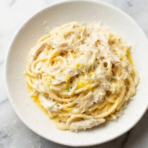 Creamy Lemon Chicken Pasta tossed in a rich sauce made by blooming lemon zest in butter and topped with fresh herbs.