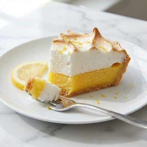 Lemon meringue pie featuring a tall, stabilized cornstarch-slurry meringue topping and zesty curd.