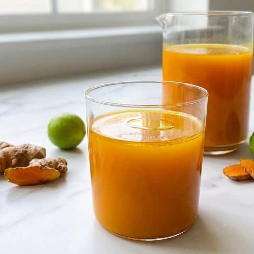 Vibrantly golden jamu juice recipe prepared with the liposomal fat-activation method for high bioavailability.