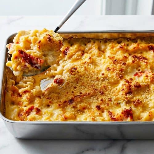 Creamy lobster mac and cheese recipe with a rich bisque-style brown butter and brandy cheese sauce.